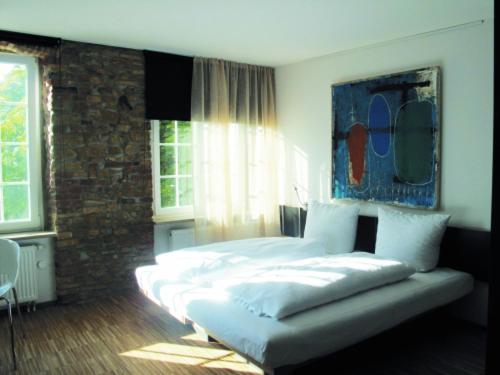 Postel nebo postele na pokoji v ubytování OX Hotel