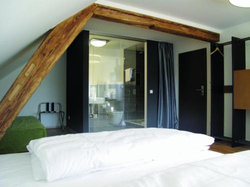 Postel nebo postele na pokoji v ubytování OX Hotel