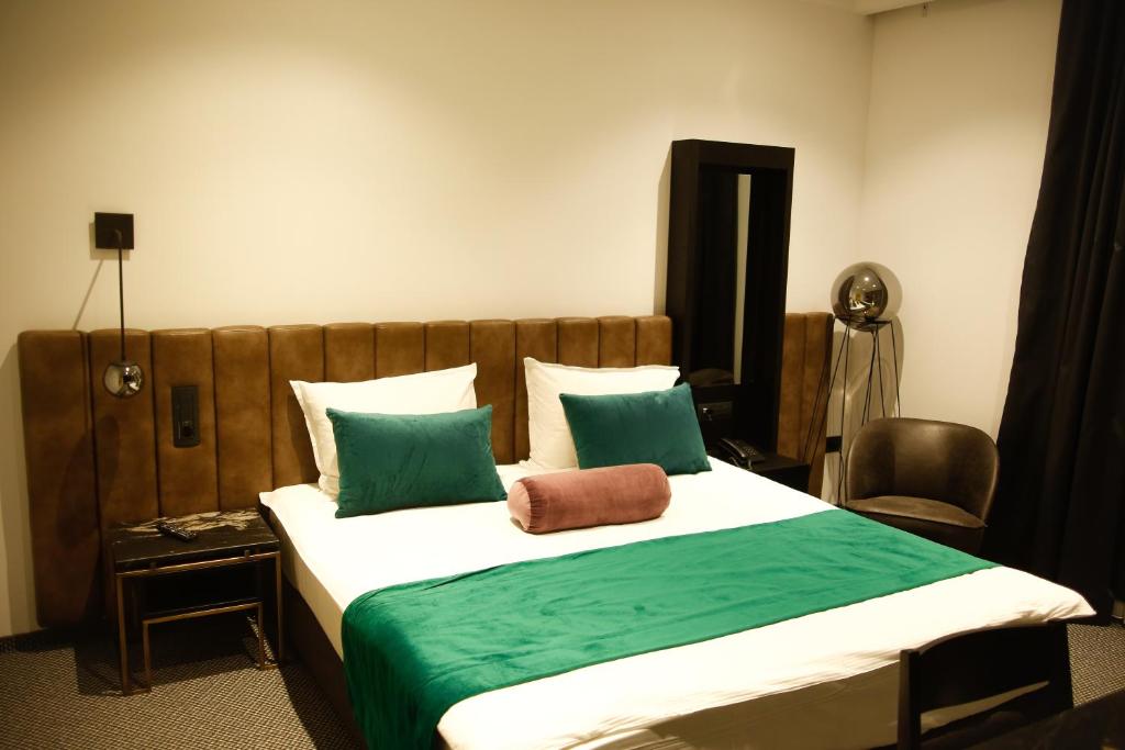 Postel nebo postele na pokoji v ubytování Hotel Rubis