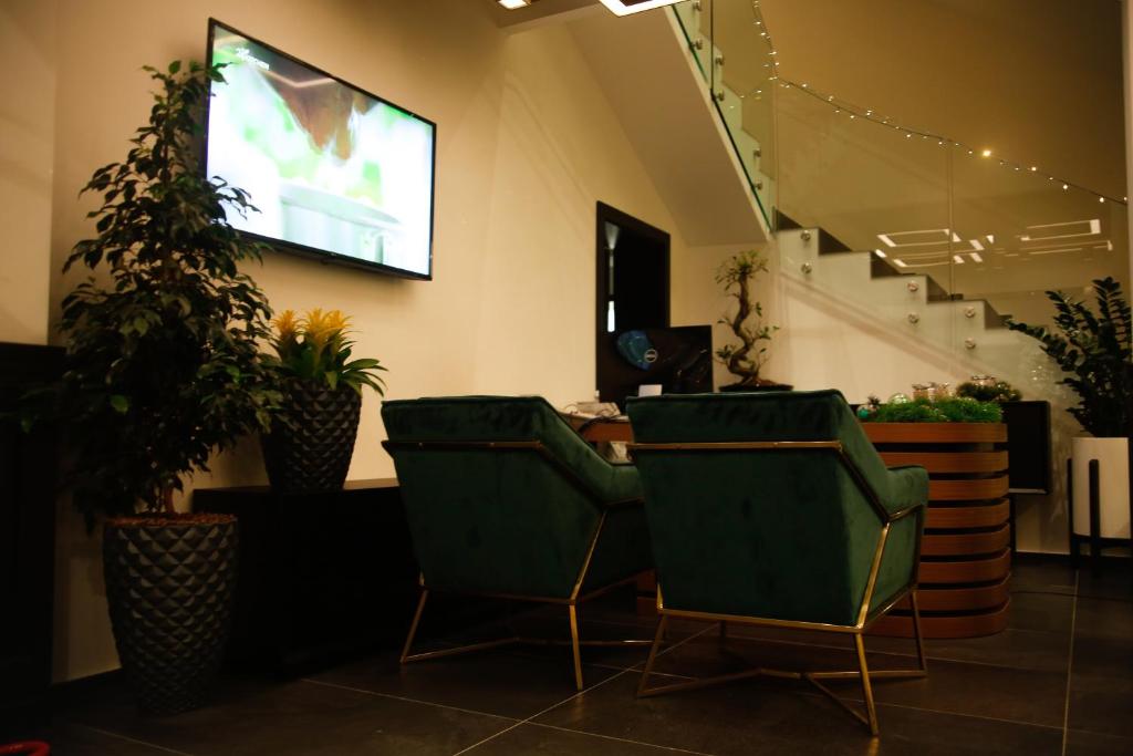 TV a/nebo společenská místnost v ubytování Hotel Rubis