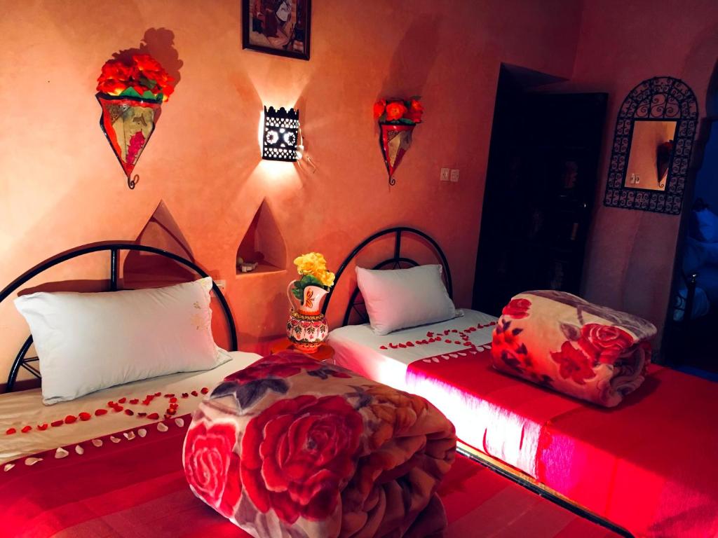 Postel nebo postele na pokoji v ubytování Kasbah Tiriguioute
