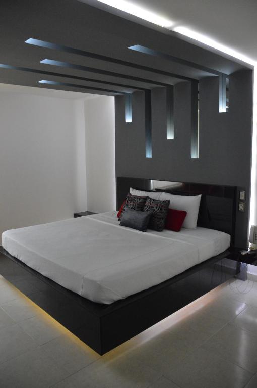 Postel nebo postele na pokoji v ubytování Auto Hotel Mediterráneo