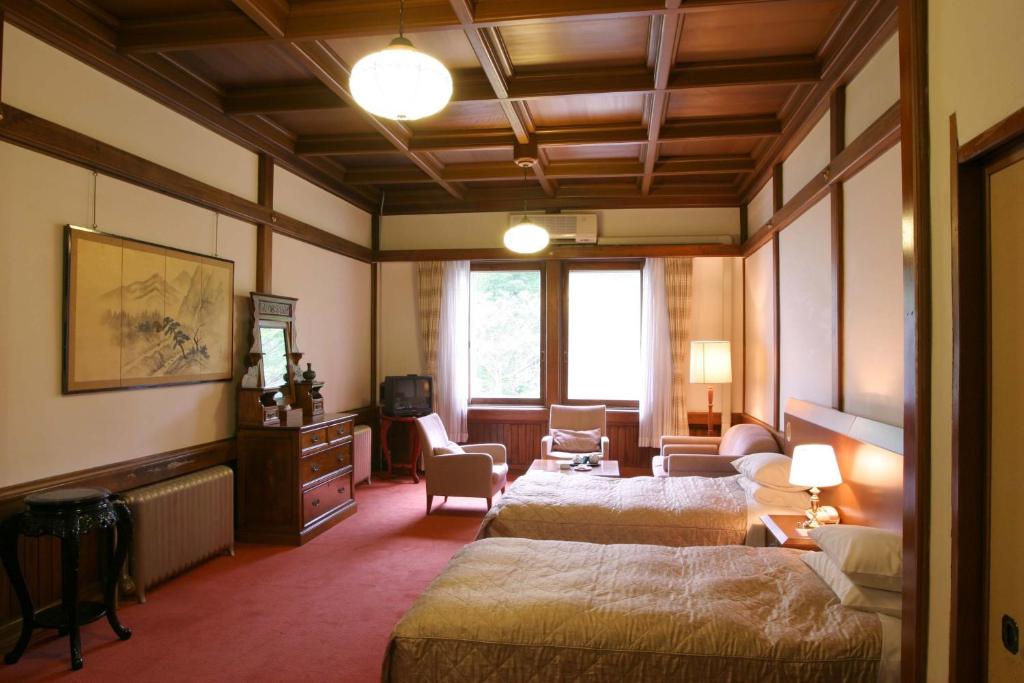 Postel nebo postele na pokoji v ubytování Nikko Kanaya Hotel