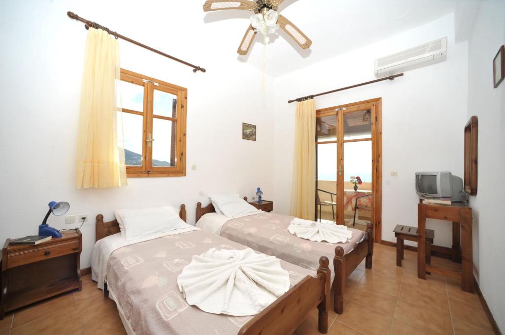 Posteľ alebo postele v izbe v ubytovaní BBB - Barbati Blick Bungalows