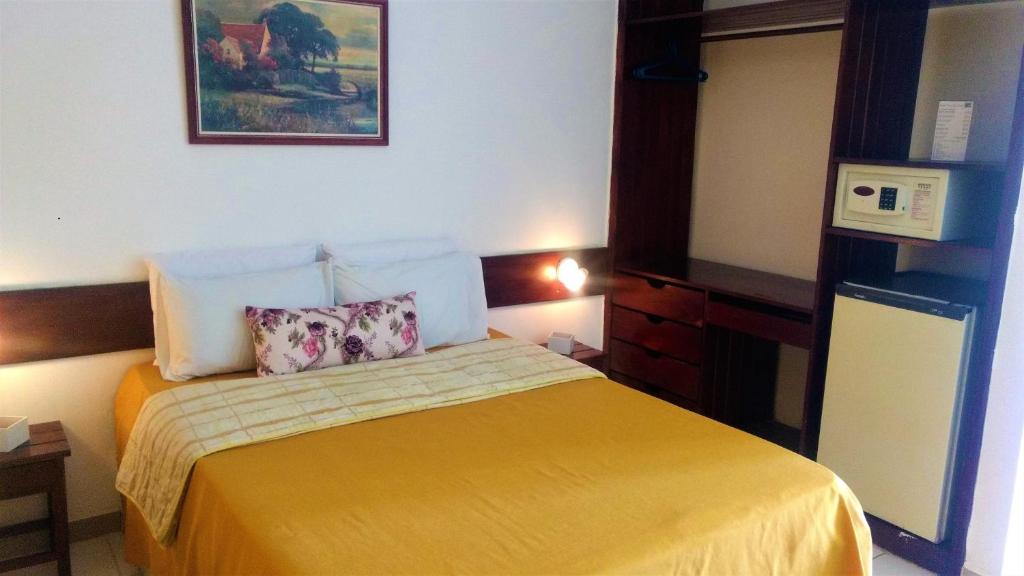 Postel nebo postele na pokoji v ubytování Hotel Praia do Conde