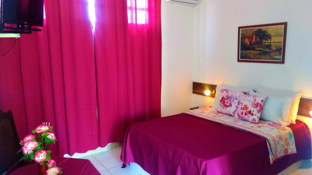 Postel nebo postele na pokoji v ubytování Hotel Praia do Conde