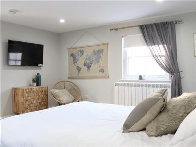 a bedroom with a white bed and a window at Chapel Lodge - Roof top garden!Perfect for your family in Bath