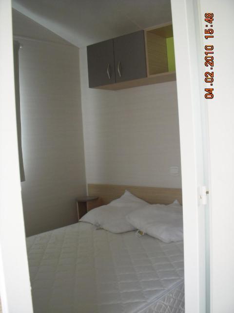 Postel nebo postele na pokoji v ubytování Camping de Brouël