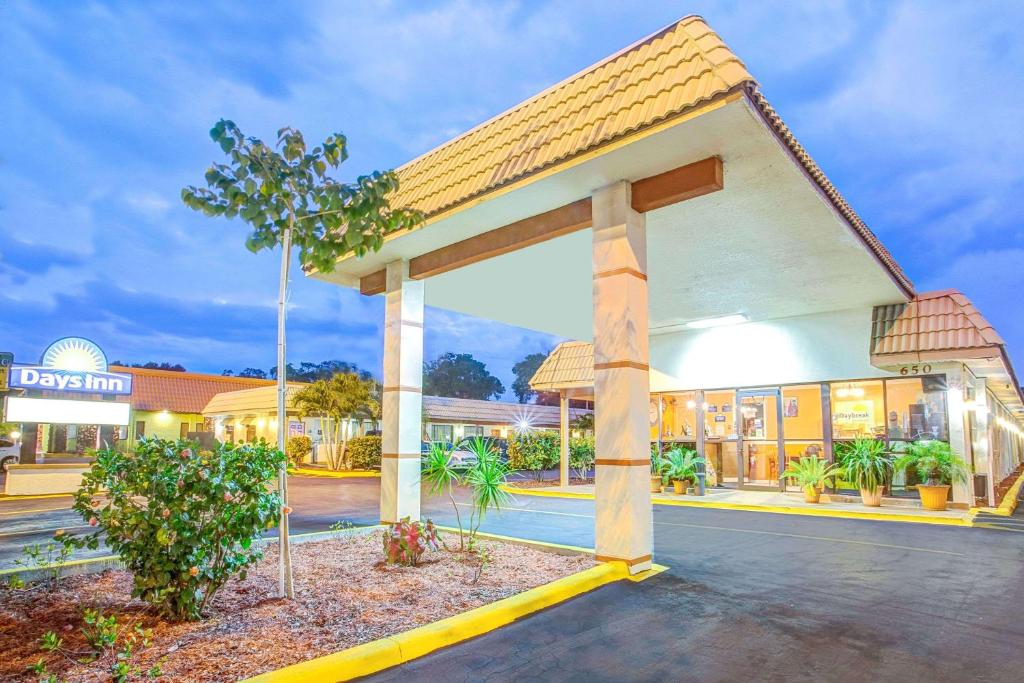 an empty parking lot in front of a building at Days Inn by Wyndham St. Petersburg Central in St Petersburg