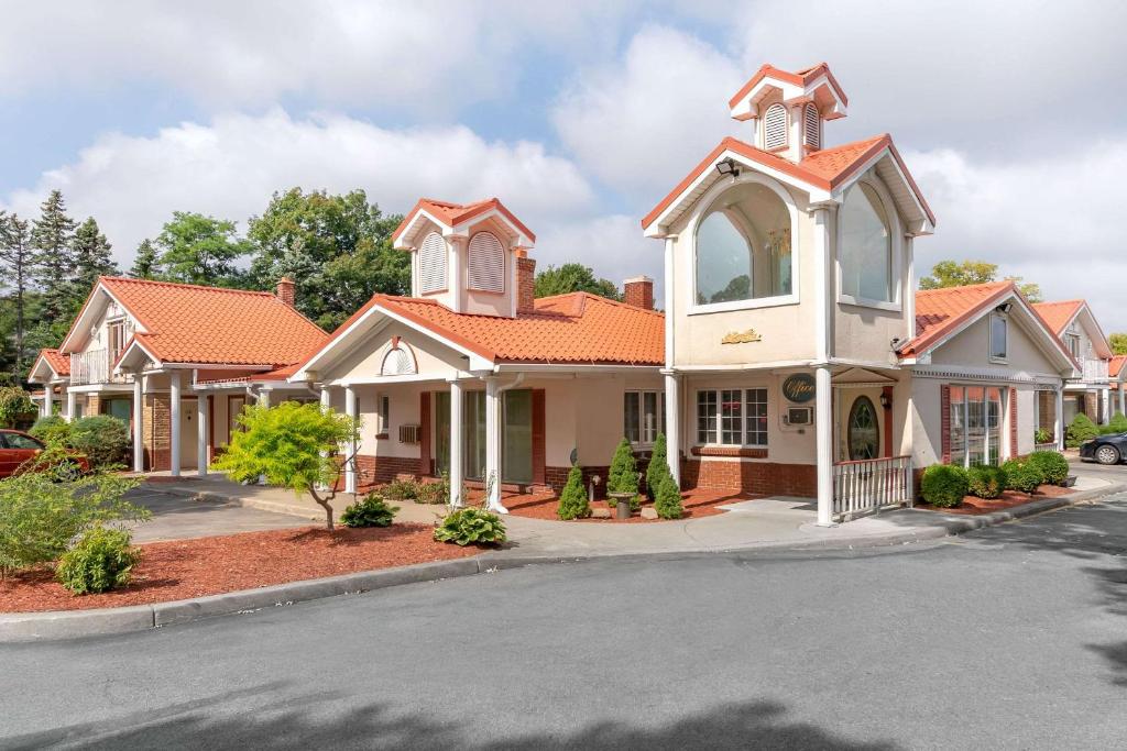 a house with an orange roof at Village Haven inn in Clarence