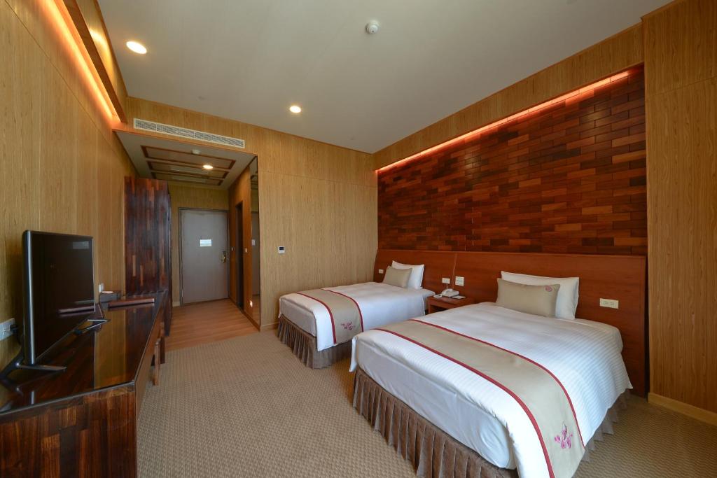 TV a/nebo společenská místnost v ubytování Shandori Hotel