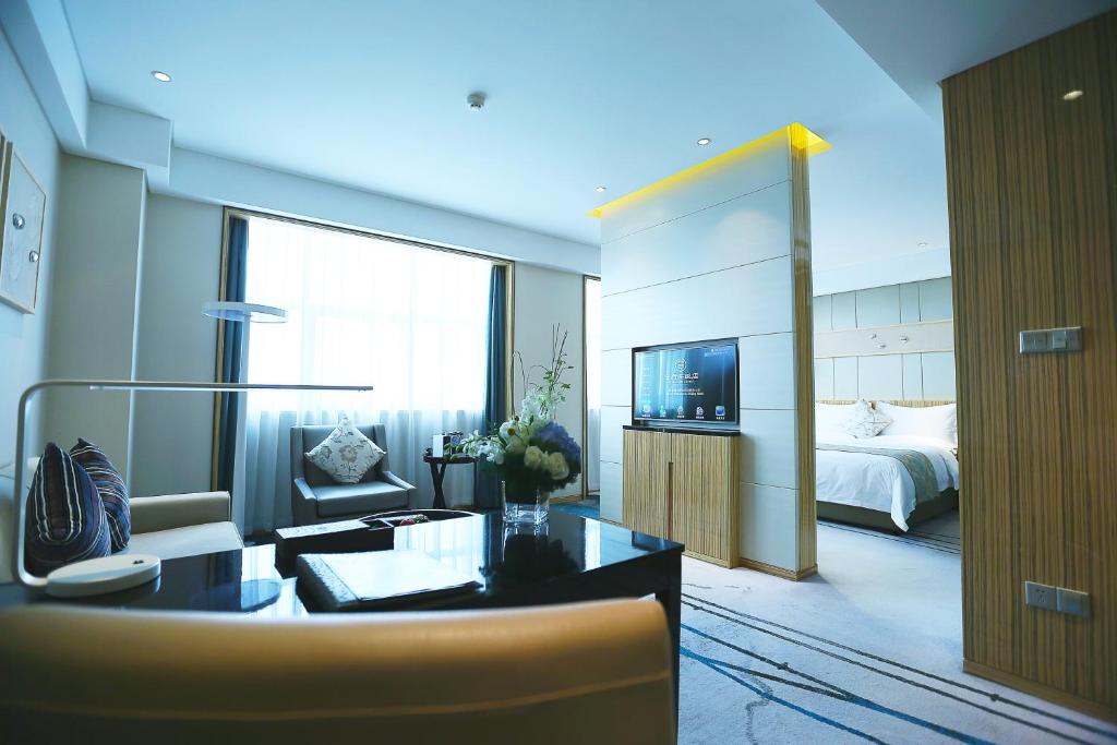 Postel nebo postele na pokoji v ubytování Yinchuan Xifujing Hotel