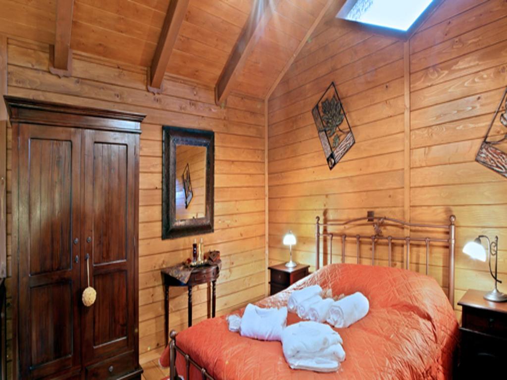 Postel nebo postele na pokoji v ubytování Feggarognemata Suites