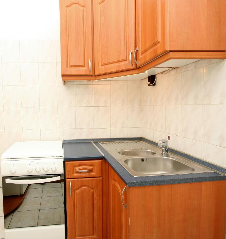 Kuchyňa alebo kuchynka v ubytovaní City Centre Cosy Apartments