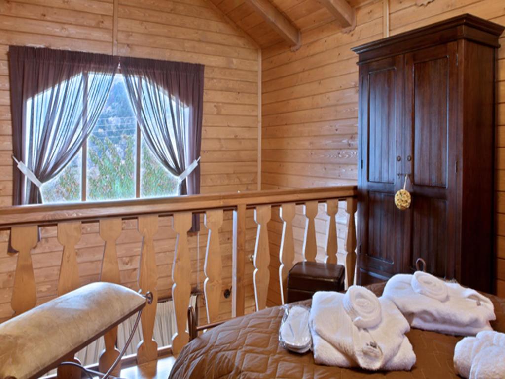 Postel nebo postele na pokoji v ubytování Feggarognemata Suites