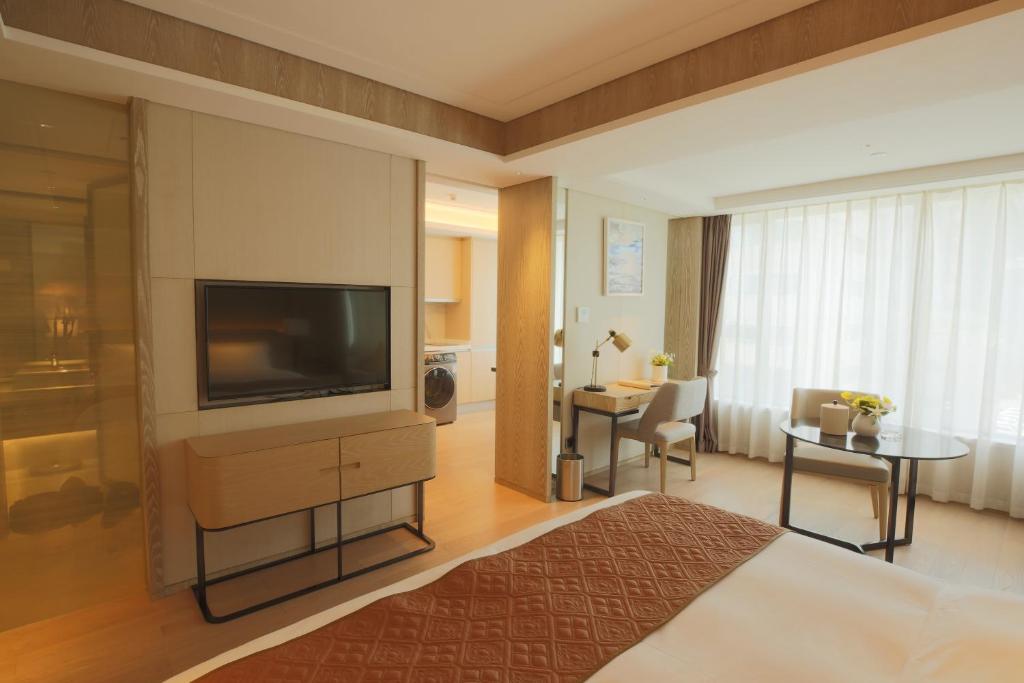 TV a/nebo společenská místnost v ubytování Shenzhen FY Hotel