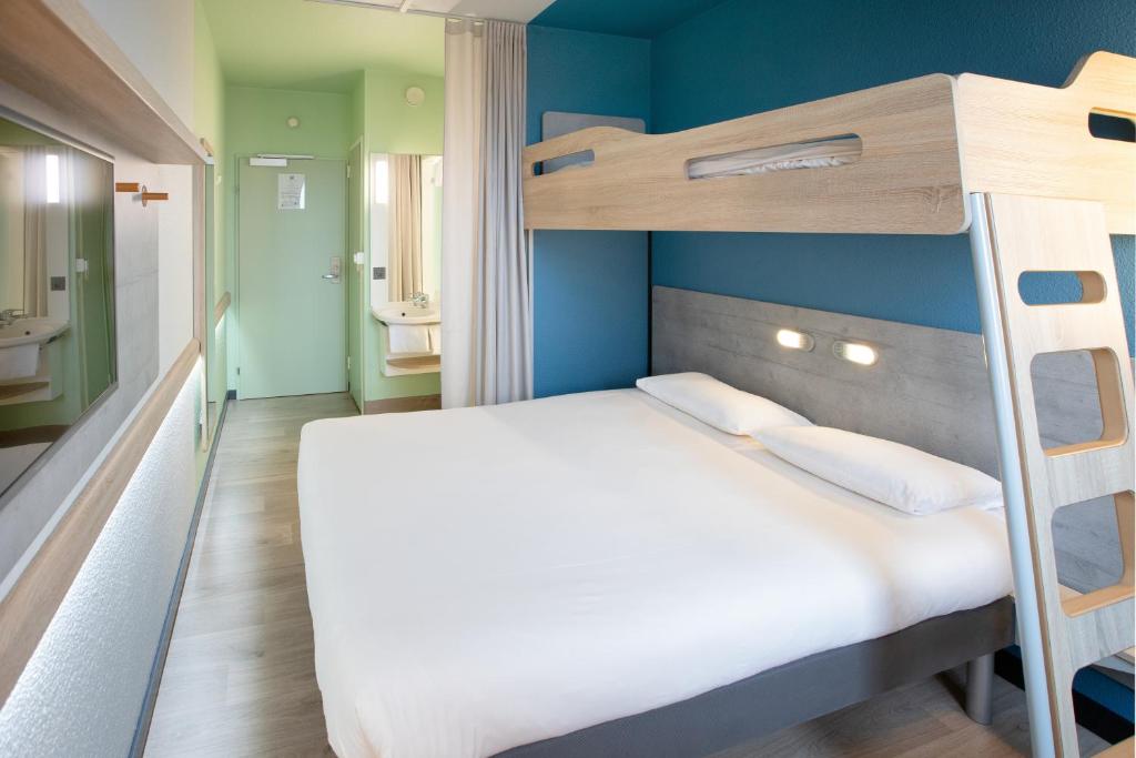 Postel nebo postele na pokoji v ubytování ibis budget Genève Aéroport