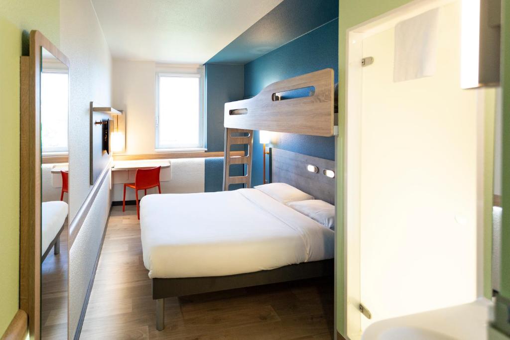Postel nebo postele na pokoji v ubytování ibis budget Genève Aéroport