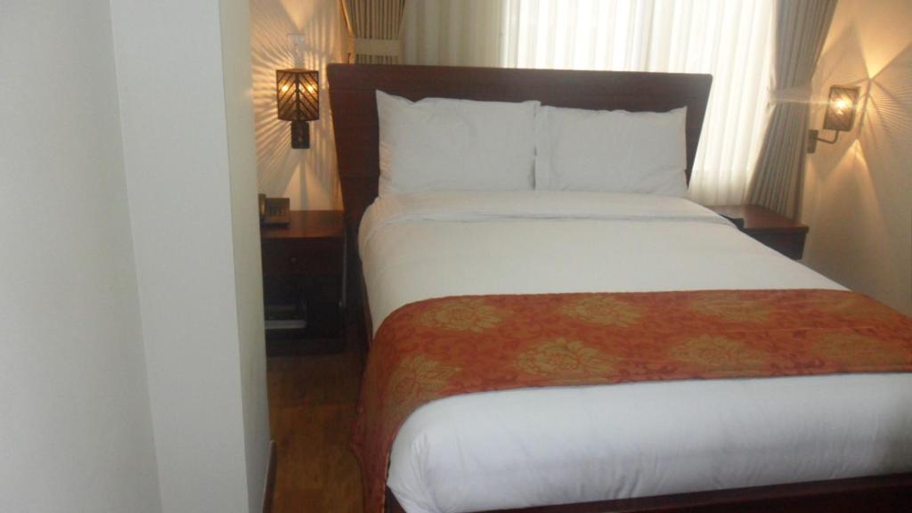 Postel nebo postele na pokoji v ubytování Hotel Splendor by Friends Company
