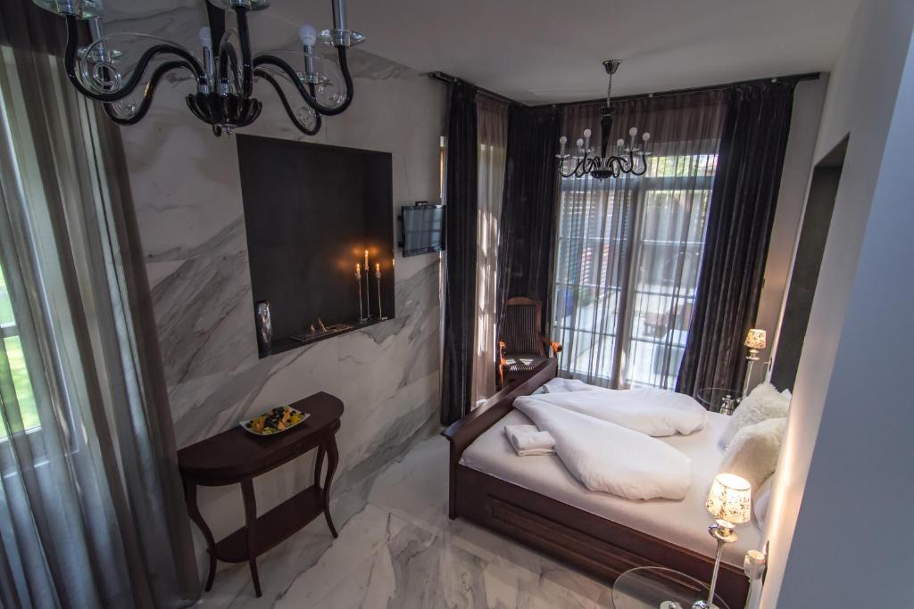 Postel nebo postele na pokoji v ubytování Boutique Hotel Annuska