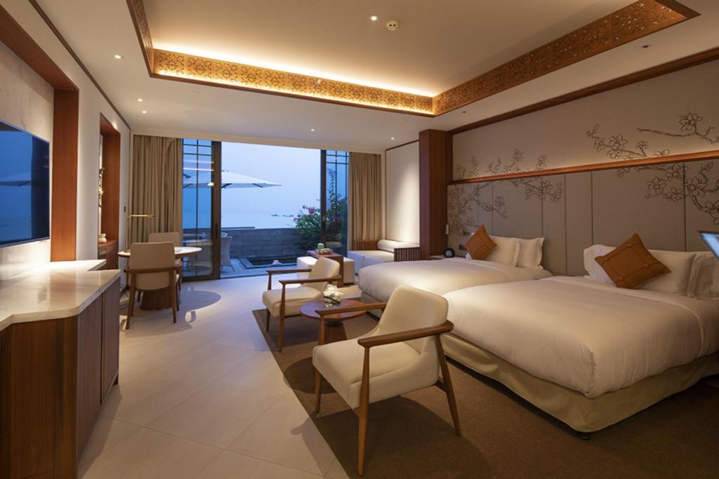 Postel nebo postele na pokoji v ubytování Angsana Zhuhai Phoenix Bay