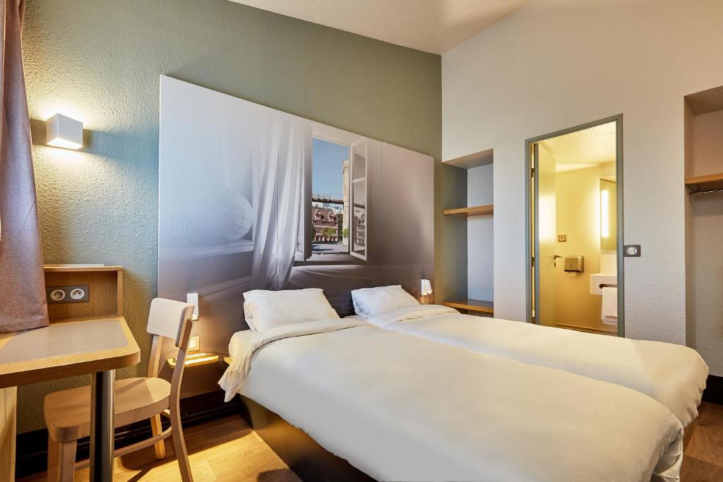 Postel nebo postele na pokoji v ubytování B&B HOTEL CAEN Sud