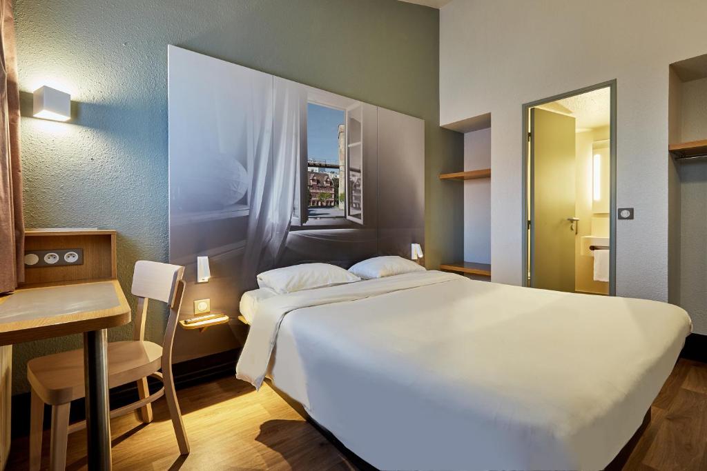 Postel nebo postele na pokoji v ubytování B&B HOTEL CAEN Sud