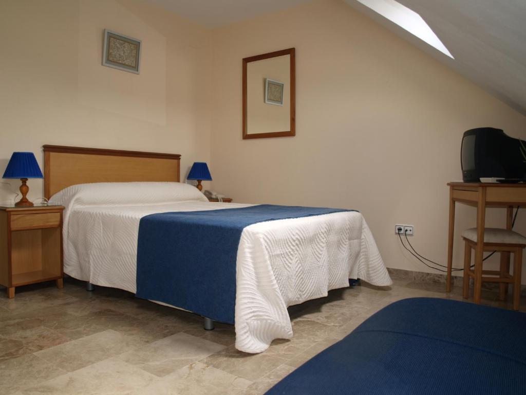 Postel nebo postele na pokoji v ubytování Hotel Al-Yussana
