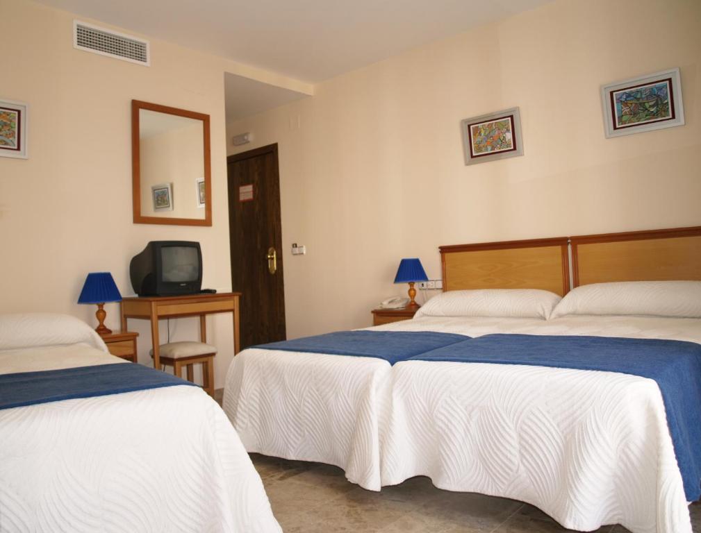Postel nebo postele na pokoji v ubytování Hotel Al-Yussana