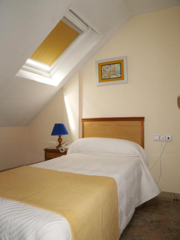 Postel nebo postele na pokoji v ubytování Hotel Al-Yussana