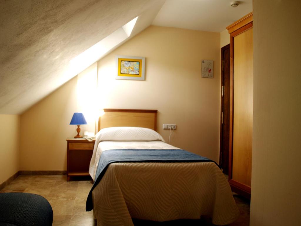 Postel nebo postele na pokoji v ubytování Hotel Al-Yussana