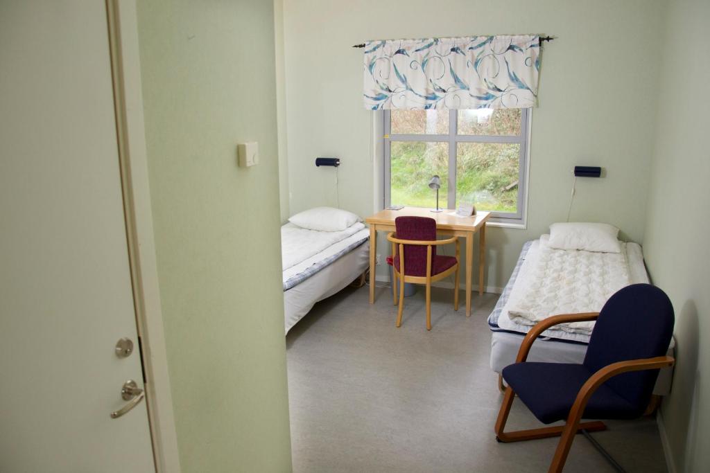 Postel nebo postele na pokoji v ubytování Örtagården