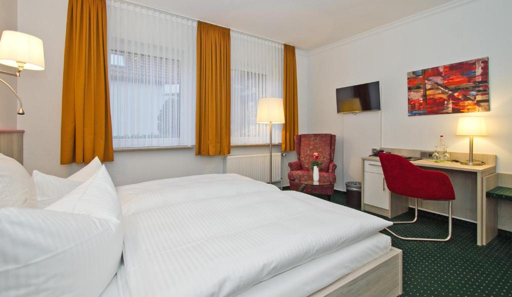 Postel nebo postele na pokoji v ubytování Hotel Schaper