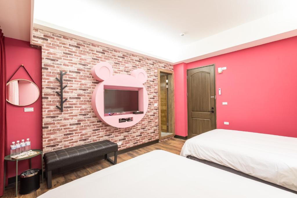 Postel nebo postele na pokoji v ubytování Peach blossom B&B