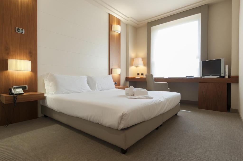Postel nebo postele na pokoji v ubytování Hotel Barrage