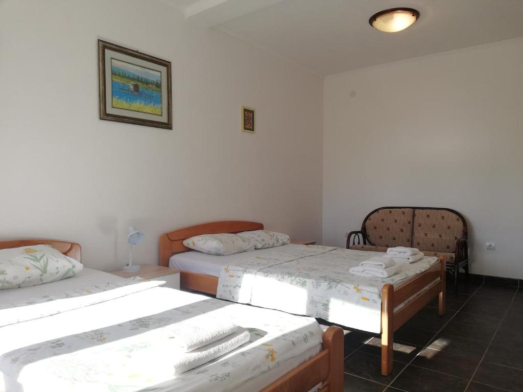 Postel nebo postele na pokoji v ubytování Apart Hotel Forte Roses Montenegro KO Buljarica
