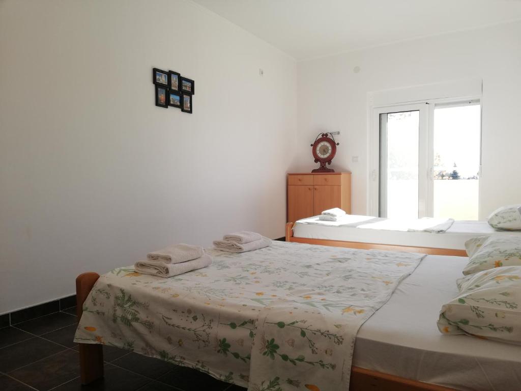 Postel nebo postele na pokoji v ubytování Apart Hotel Forte Roses Montenegro KO Buljarica