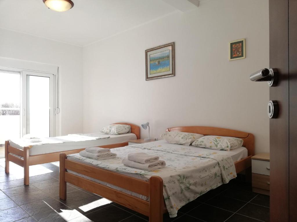 Postel nebo postele na pokoji v ubytování Apart Hotel Forte Roses Montenegro KO Buljarica