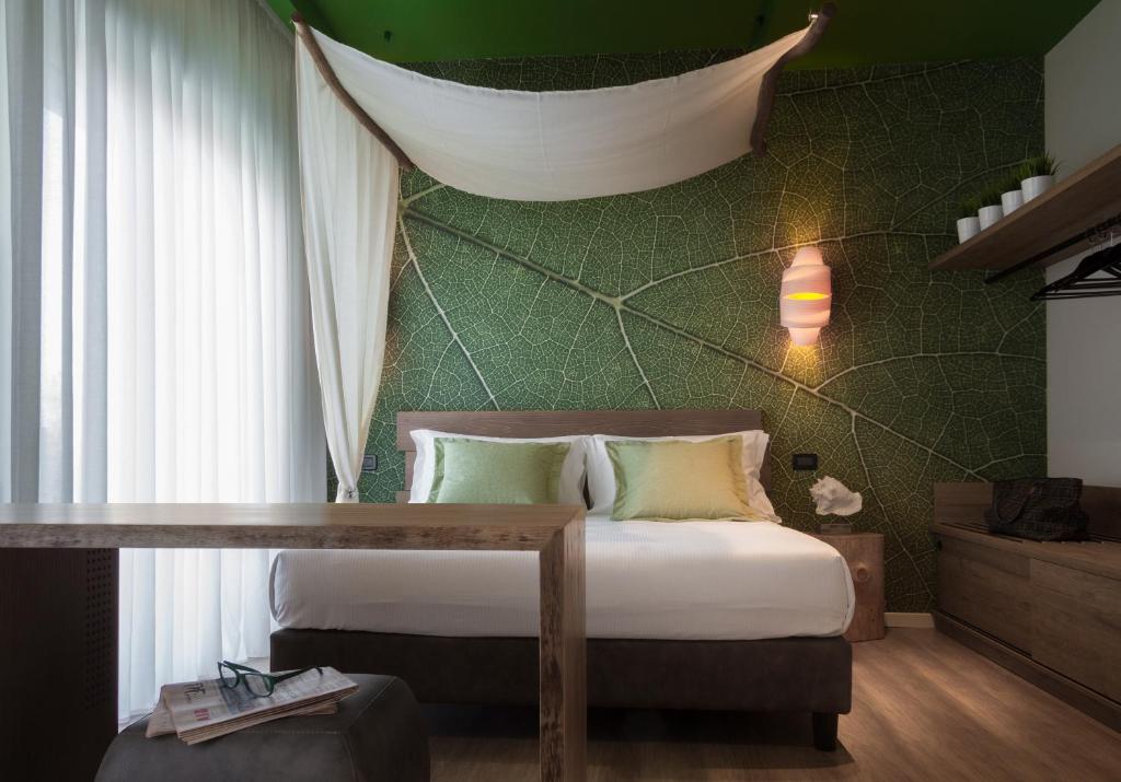 Postel nebo postele na pokoji v ubytování Litoraneo Suite Hotel