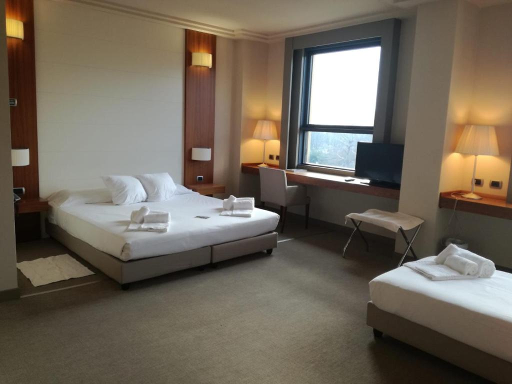 Postel nebo postele na pokoji v ubytování Hotel Barrage