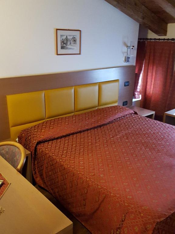 Postel nebo postele na pokoji v ubytování Hotel and Wellness Patriarca