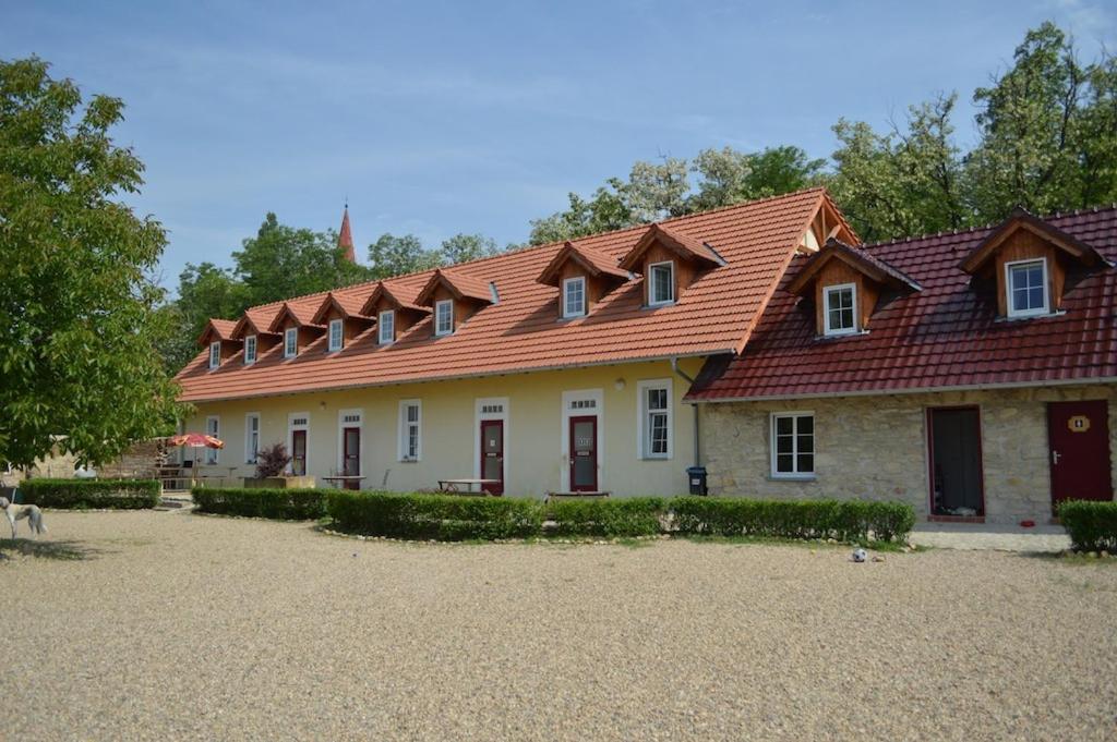a house with a red roof on top of it at Stará Fara in Chržín