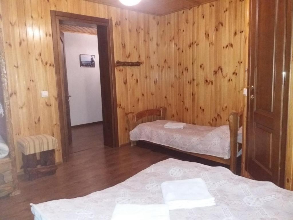 Postel nebo postele na pokoji v ubytování Hotel Dudarik