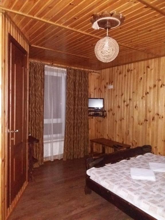 Postel nebo postele na pokoji v ubytování Hotel Dudarik