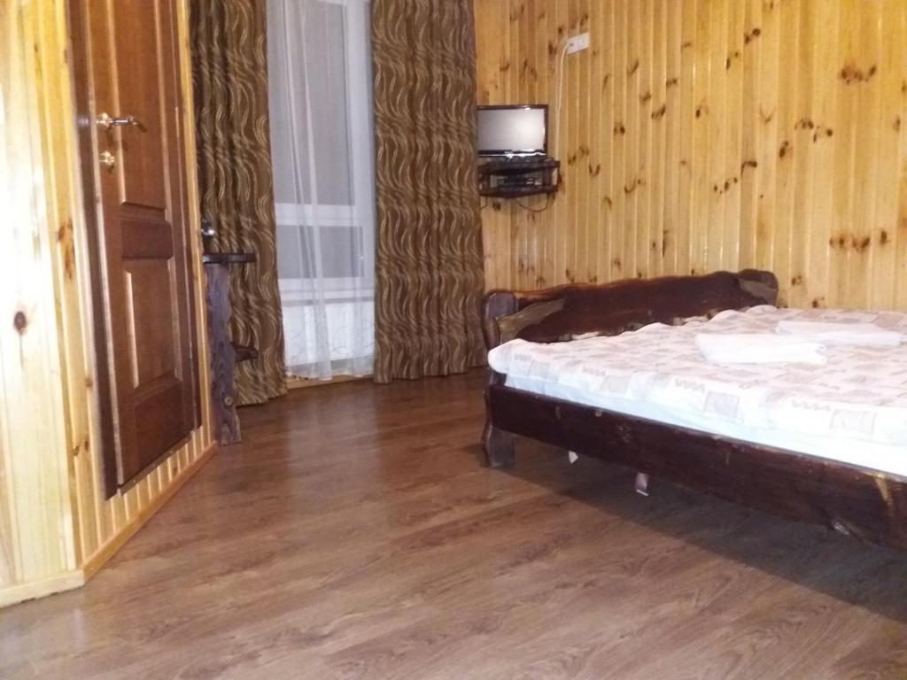 Postel nebo postele na pokoji v ubytování Hotel Dudarik