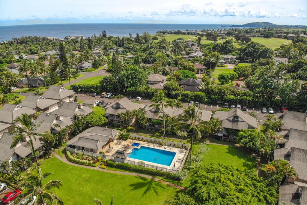 an aerial view of a resort with a swimming pool at SandPiper #116a in Princeville