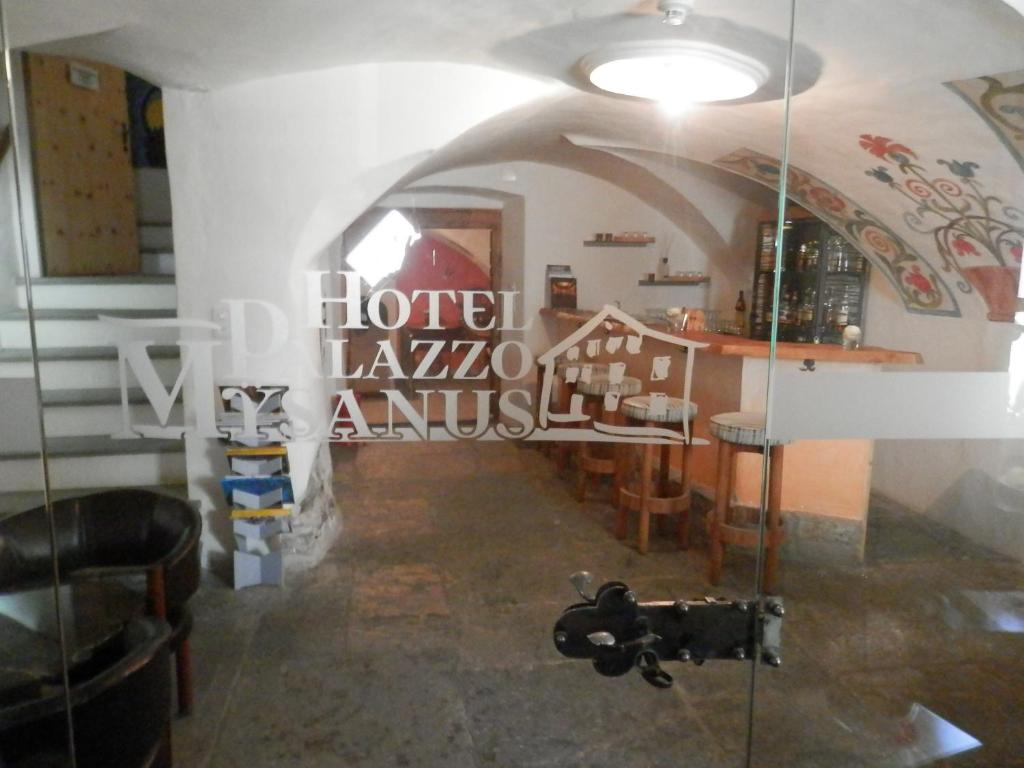 a room with a glass door in a building at Palazzo Mysanus Samedan in Samedan