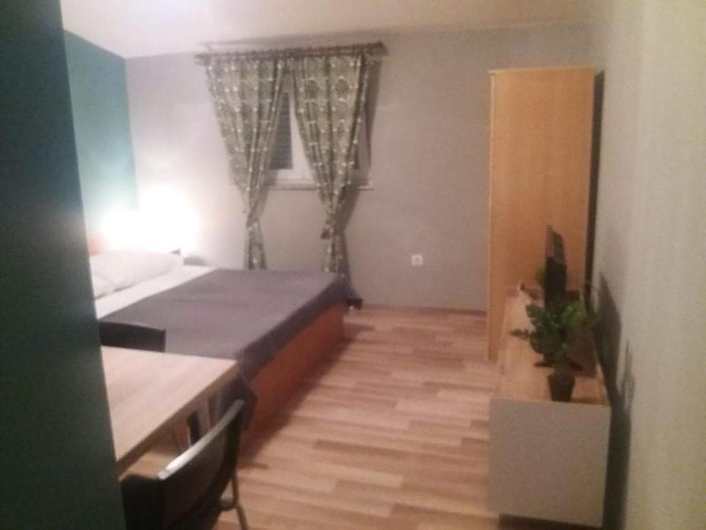 Postel nebo postele na pokoji v ubytování Apartments Danijela