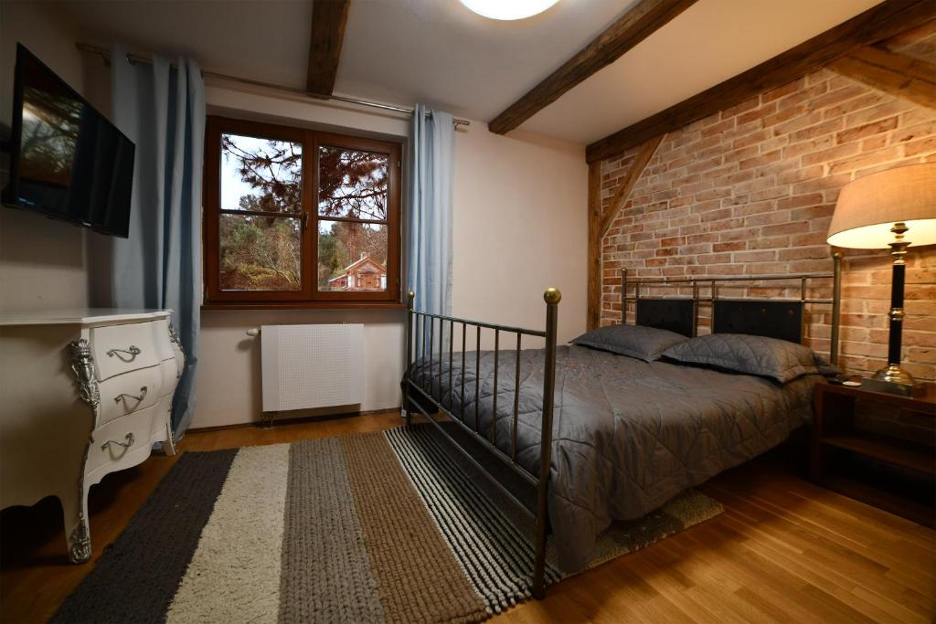 Postel nebo postele na pokoji v ubytování Apartamenty Dom Niezwykly