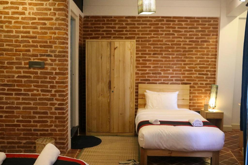 Postel nebo postele na pokoji v ubytování Chibha Classic Inn